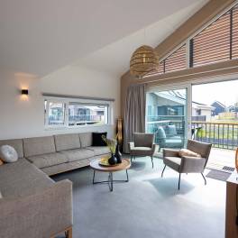 The Woonkamer of nr. 402 - type Watervilla Luxe 8 in Landal Zeebad