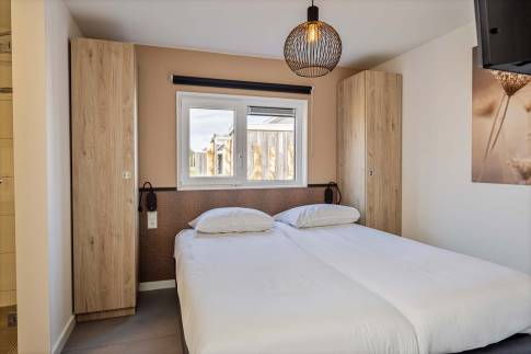 The Slaapkamer 2 of nr. 014 - type Strandlodge 8 in Vakantiepark Boomhiemke