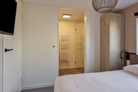 The Slaapkamer 2 of Type Strandlodge 8 - nr. 14 in Vakantiepark Boomhiemke
