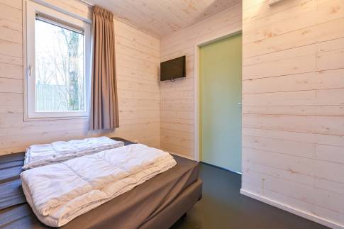 The Slaapkamer 1 of nr. 022 - type Lodge 6 in Vakantiepark Schaijk